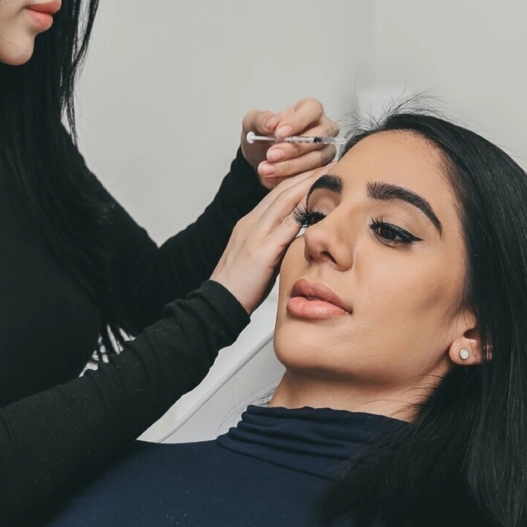 Woman doing cosmetic injections
