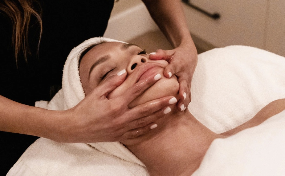 Woman doing facial treatment