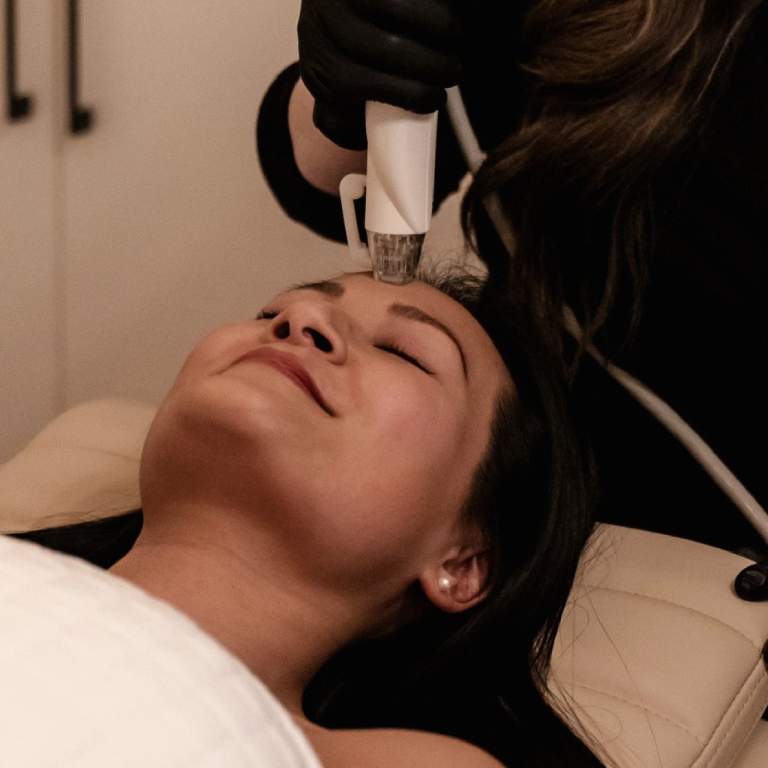 Woman doing laser treatment natology