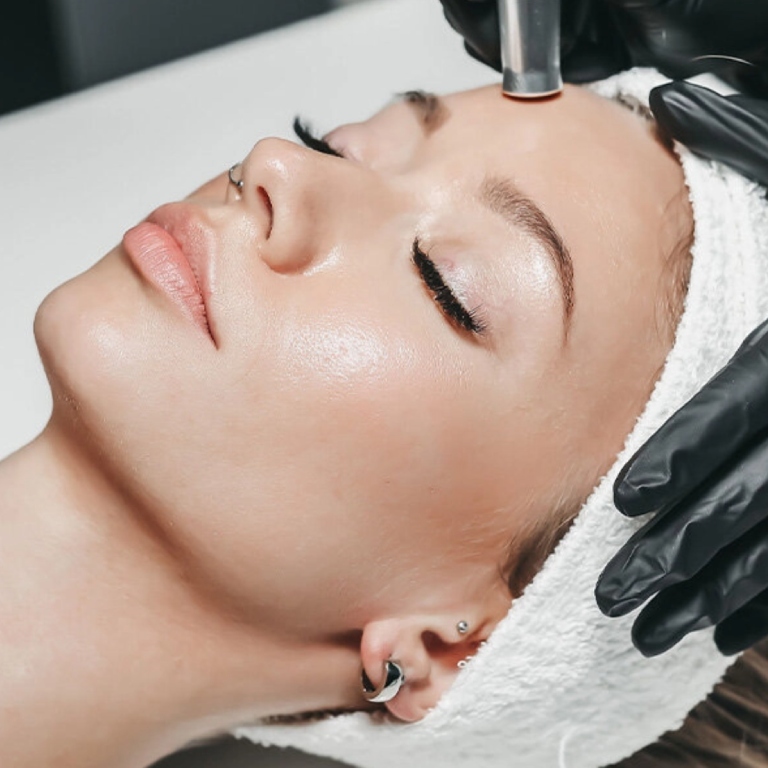 Woman doing microneedling treatment clinic